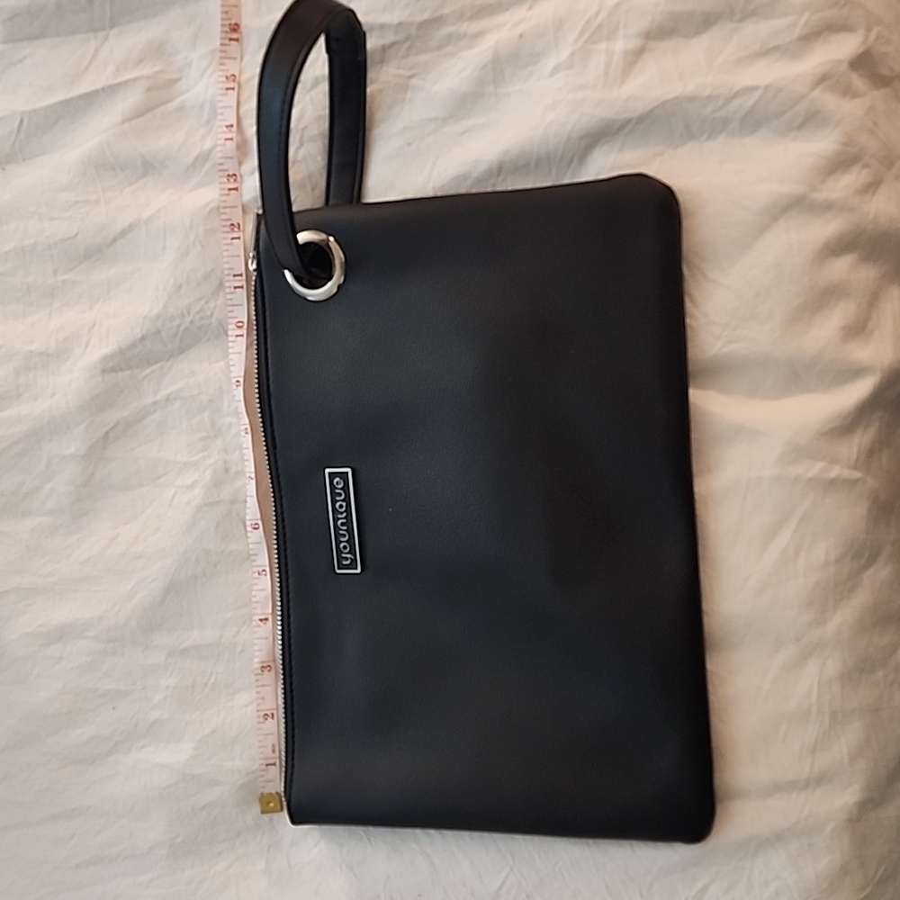 Younique vegan leather pouch with wristlet strap